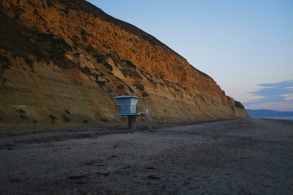 Torrey Pines cliffs at dusk with lifeguard tower